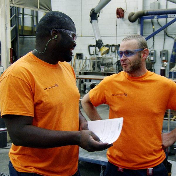 two workers in orange shirt